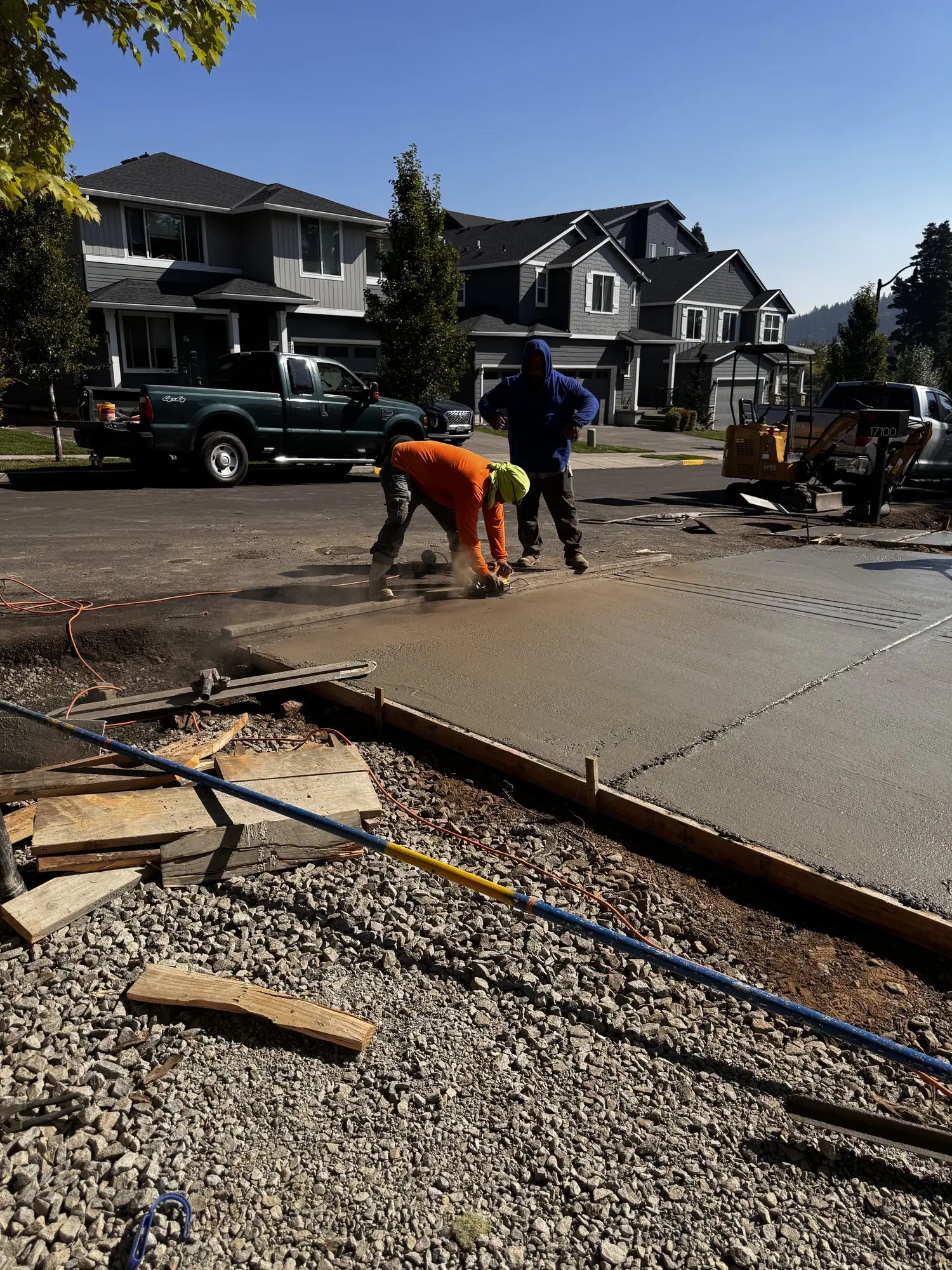 MJ Concrete crew finishing a fresh concrete slab