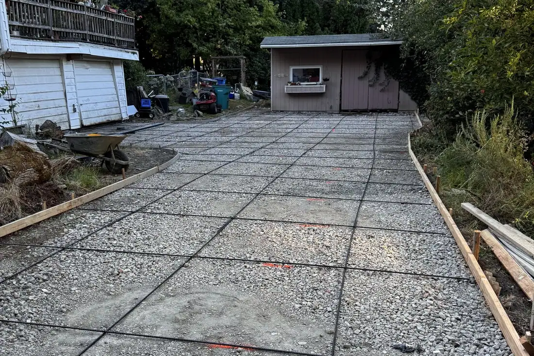 Exposed aggregate concrete driveway with control joints, poured by MJ Concrete