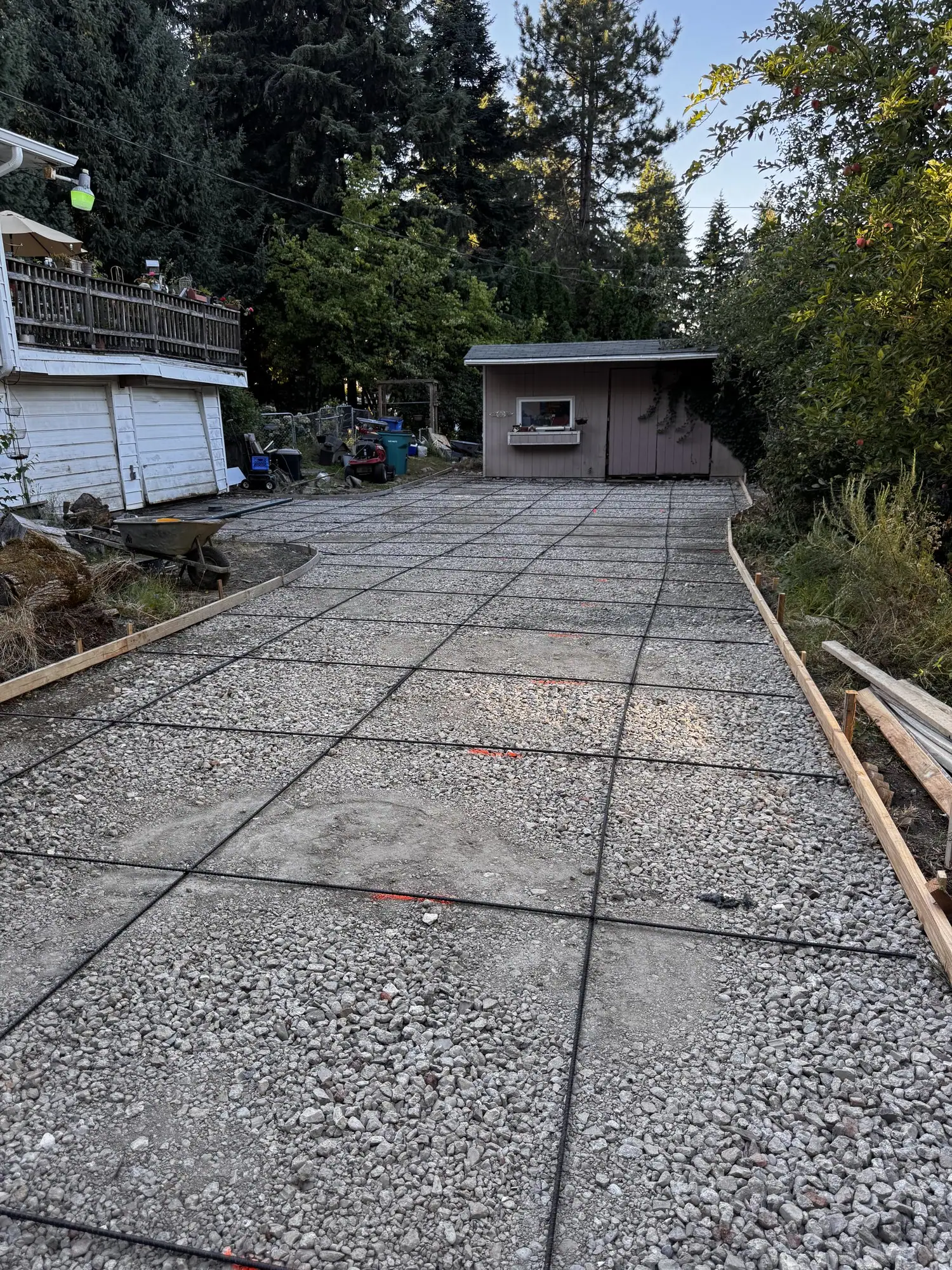 Exposed aggregate concrete driveway with control joints, poured by MJ Concrete