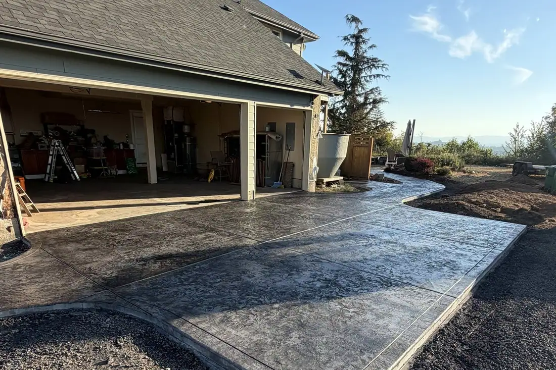 Gray stamped concrete with a smooth border at a new home