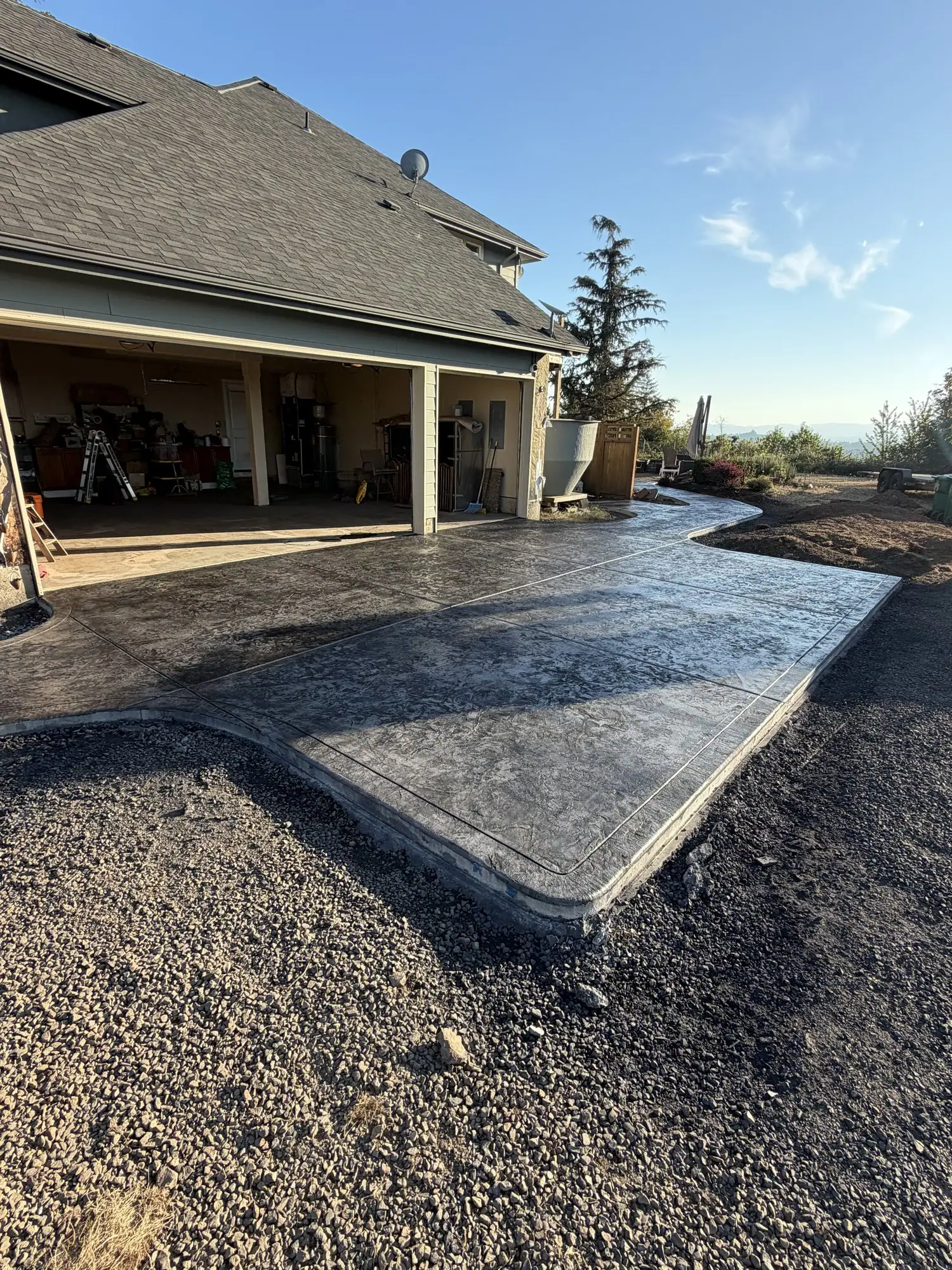 Gray stamped concrete with a smooth border at a new home