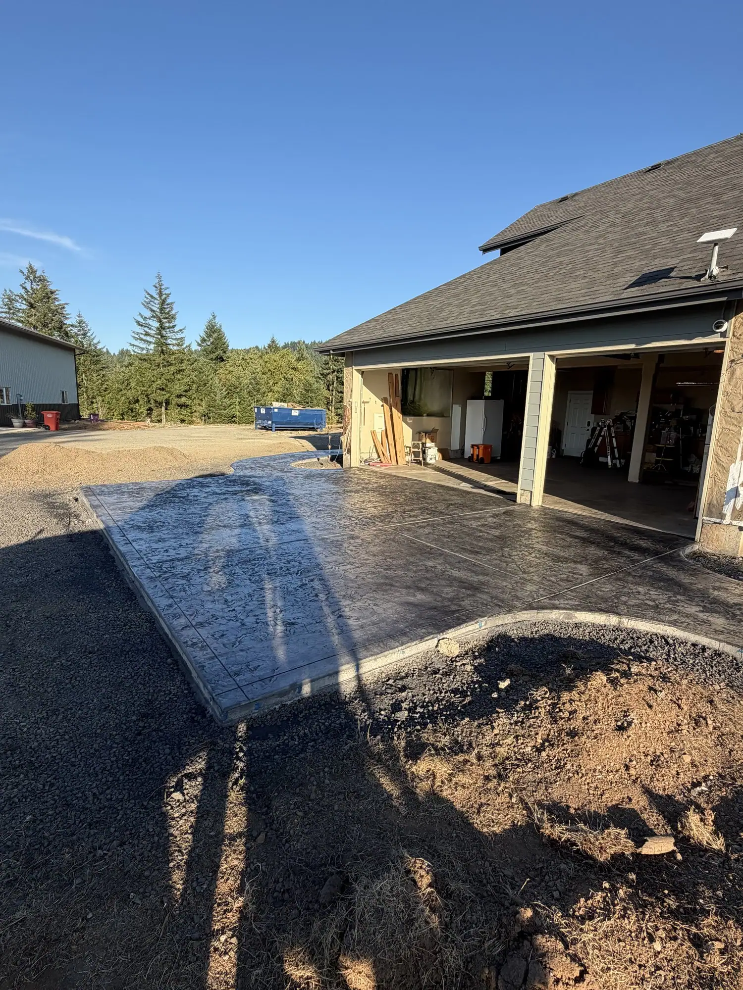 Stamped concrete slab in front of the garage of a new home