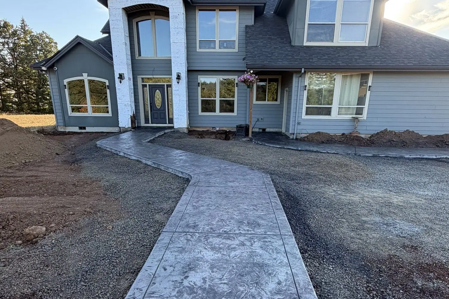 Stamped walkway up to the front door of a new home